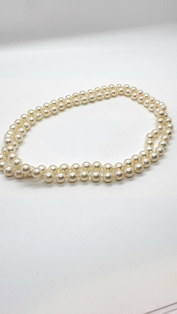 Long strand cultured pearls